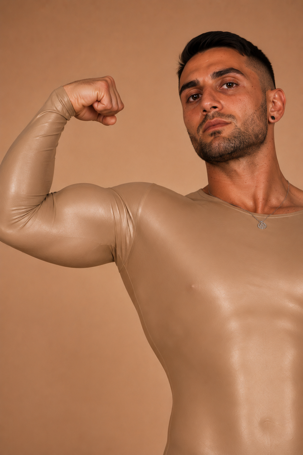 the second skin — close-up detail of sheen and fit through the arm and chest